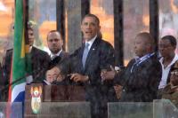 President Obama speaks at Nelson Mandela memorial with reported "fake" sign language interpreter. Photo Courtesy AFP, Pedro Ugarte.